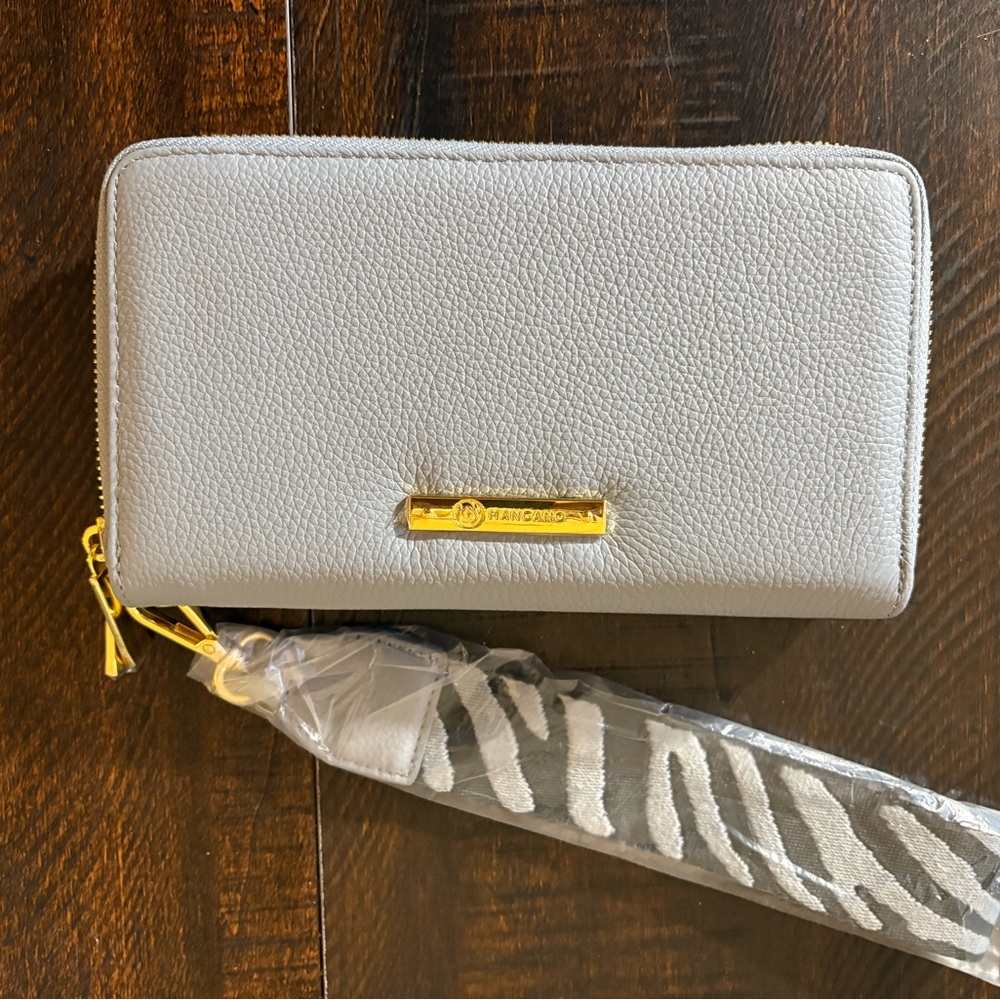 Mangano supple luxe gray wristlet with black and gray zebra strap. NWT
